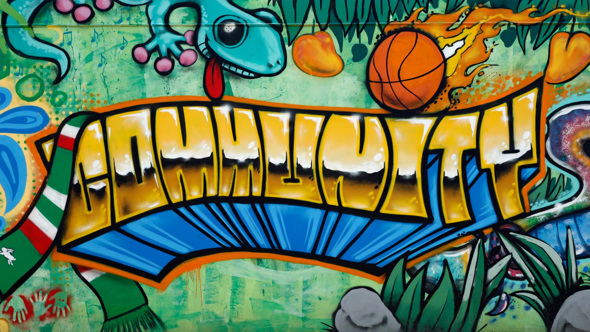 A brightly painted street mural spelling out the word Community